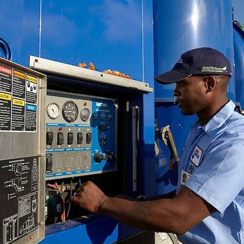 technician working on commercial water heater