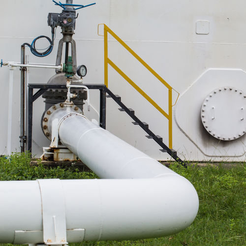 Pipe and valve oil flowing into storage tank