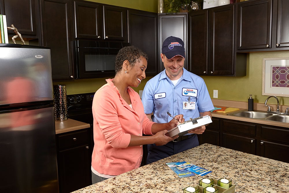 worker with customer in kitchen